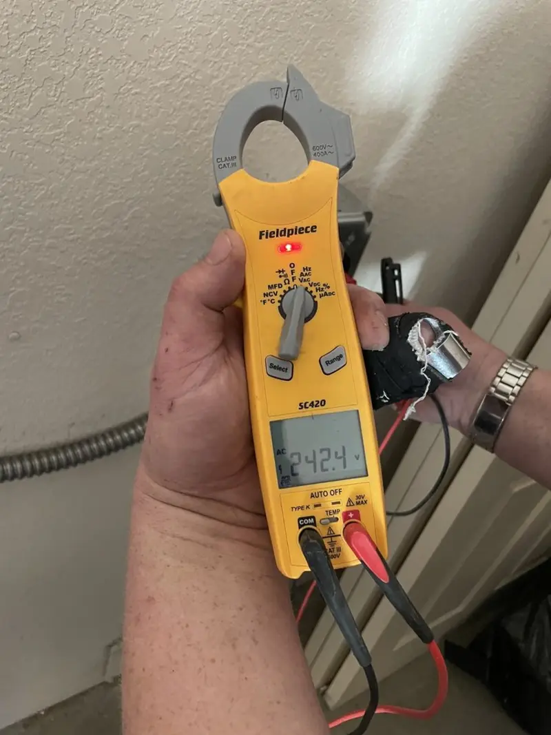 Voltage testing with clamp meter during Circuit Breaker Repair in St. Bernard